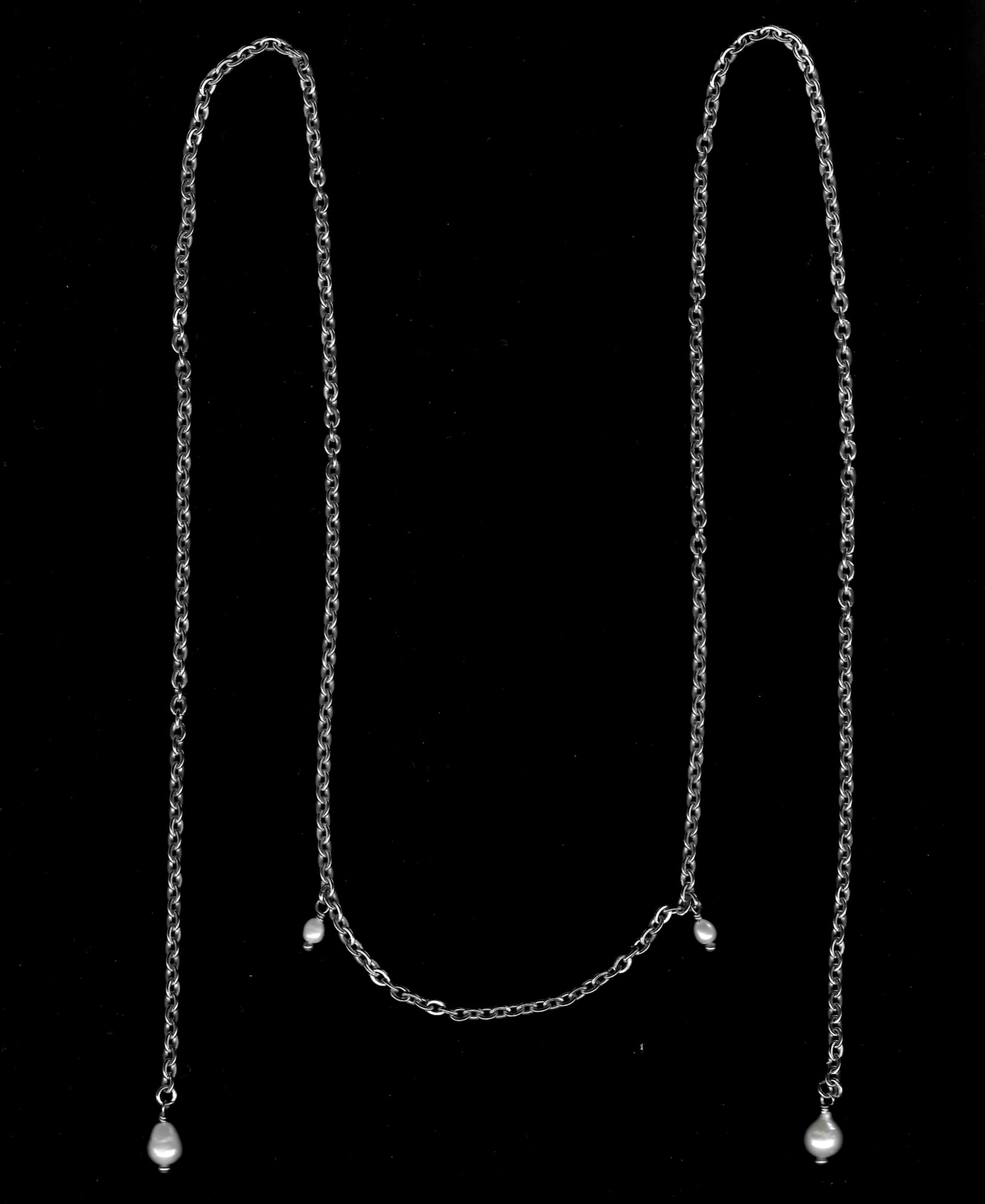 Draping Pearl Face Chains.