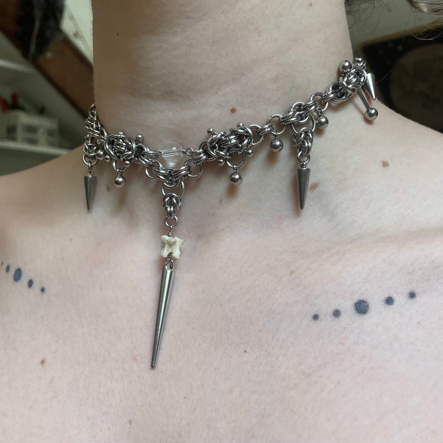 Pierced Chainmail and Bone Choker.