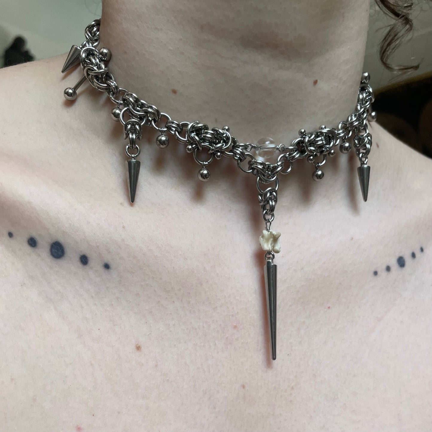 Pierced Chainmail and Bone Choker.