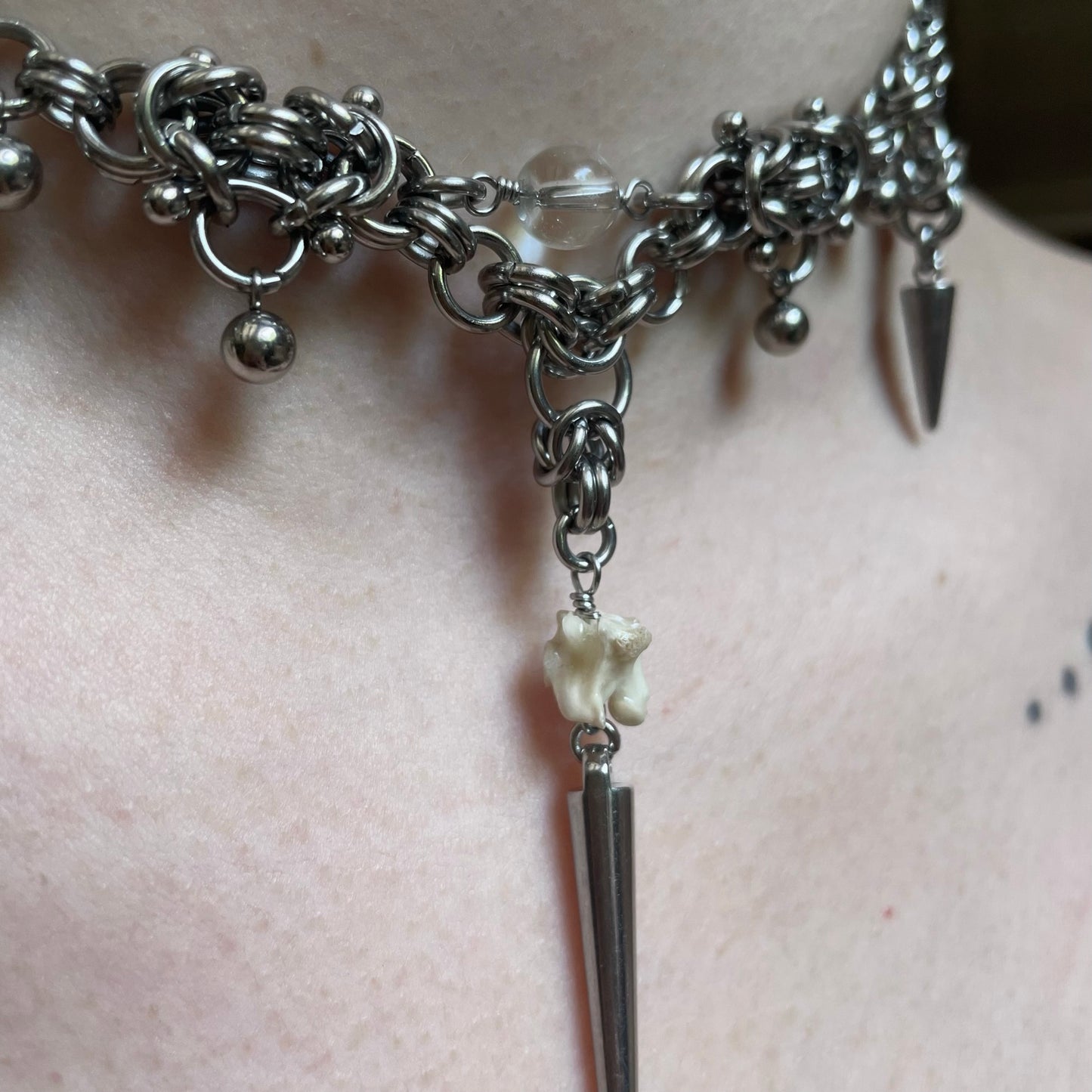 Pierced Chainmail and Bone Choker.